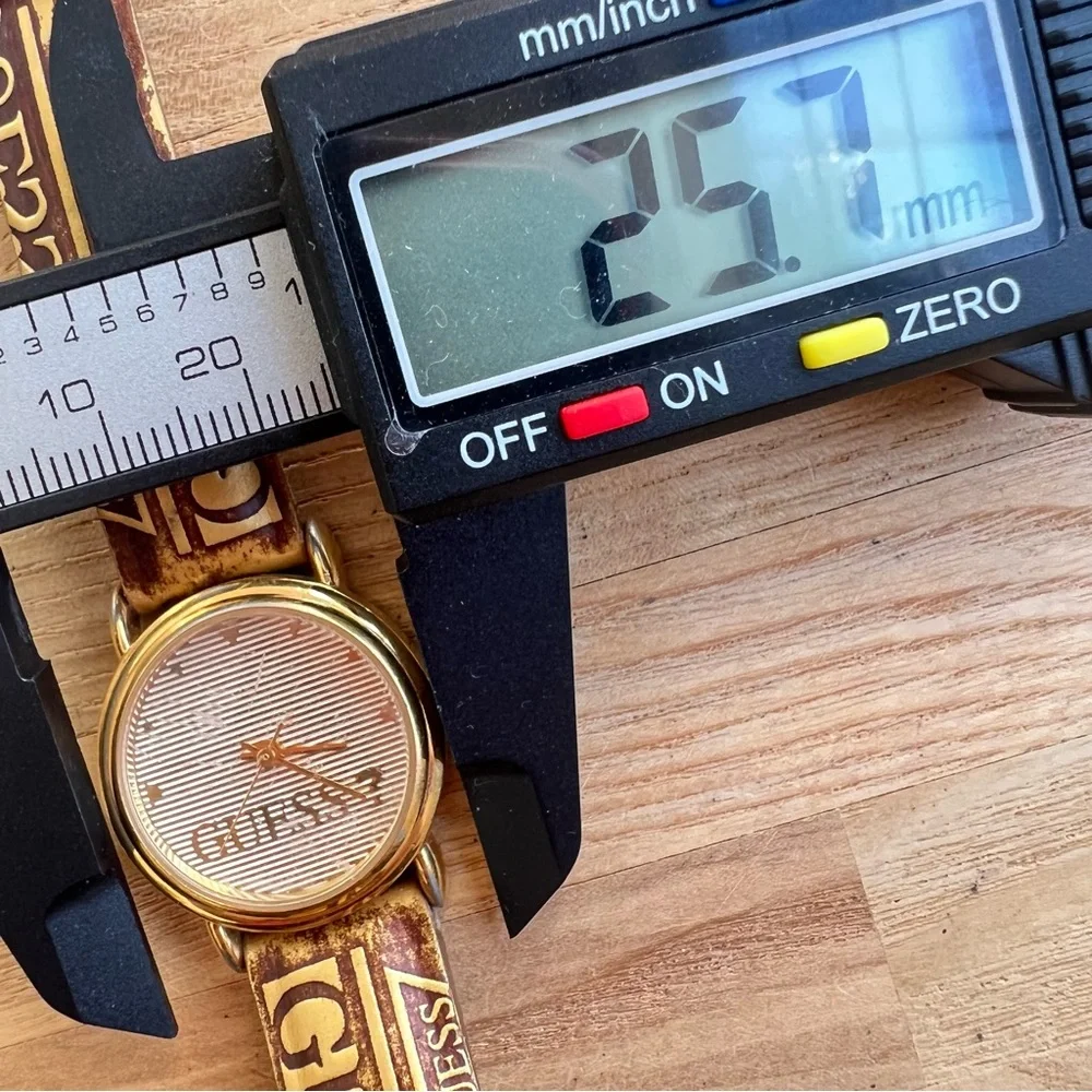 Vintage Guess ladies gold tone logo leather dress Watch NEW BATTERY